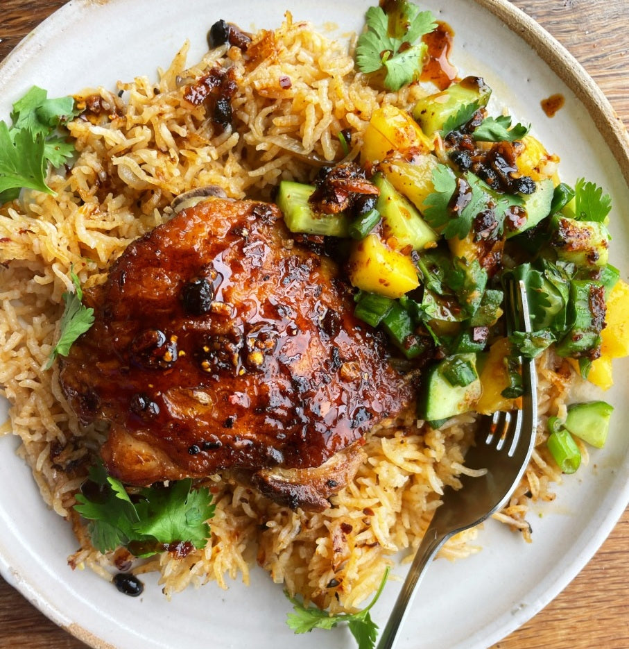 One Skillet Chili Crisp Chicken Thighs with Cucumber Mango Salsa